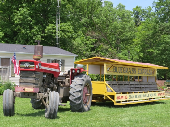 A tractor pulling a small set of bleachers.